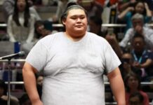 Self-Conscious Sumo Wrestler Wears White T-Shirt Into Ring