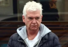 Phillip Schofield cuts glum figure as he picks up Mini from garage after Jaguar crash