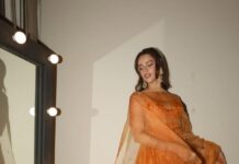 Triptii Dimri’s burnt-orange anarkali clusters mirror work along the bodice