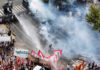 Argentinian security forces fire water cannon and tear gas at protesters