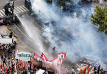 Argentinian security forces fire water cannon and tear gas at protesters