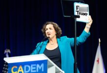 Katie Porter holds ‘F— TRUMP’ sign at California Democratic convention