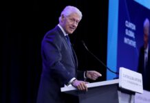 Bill Clinton Grins, Chuckles at Photo During Epstein Testimony (WTF, Dude?)