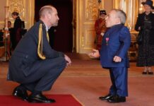 Warwick Davis beams as he is honoured with OBE from Prince William