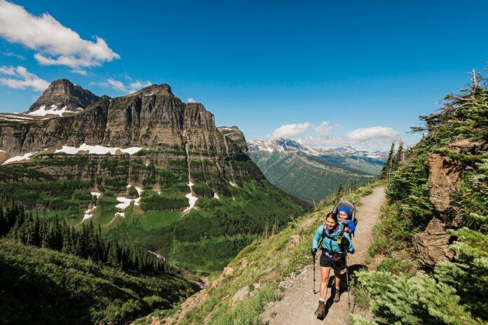 Women-and-child-hiking-on-the-Highline-Trail-in-Glacier-National-Park-Montana_Josh-Miller-PhotographyAurora-Photos.jpg