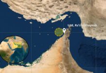 British military says a cargo ship is ablaze in the Strait of Hormuz after being hit by a projectile