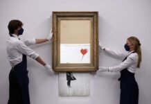 Banksy finally unmasked in only known photos of the elusive artist