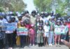 Parents And Children Join Bike Rally To Promote Helmet Use