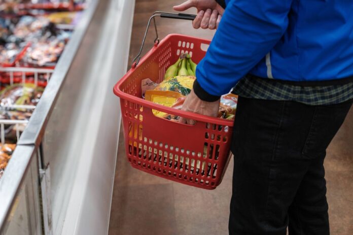0_Man-Shops-in-Frozen-Food-Section-at-Grocery-Store.jpg