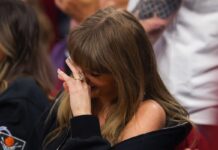 Taylor Swift can’t look as fiancé Travis Kelce downs beer at basketball and falls asleep