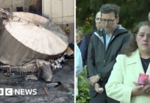 Watch: Community gathers as workers remain missing after chemical blast