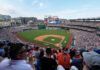 Nationals ban fan after holding white nationalist sign