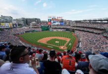 Nationals ban fan after holding white nationalist sign