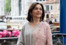 Nita Ambani’s ensemble pairs an Anamika Khanna ombré chiffon-georgette sari with a Swadesh Sozni shawl