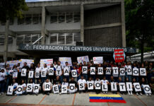 Students block main highway in Caracas to demand release of political priso
