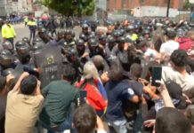 Venezuelan protesters clash with police at rally for political prisoners