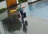 Cringe footage shows moment hotel worker accidentally falls into pool