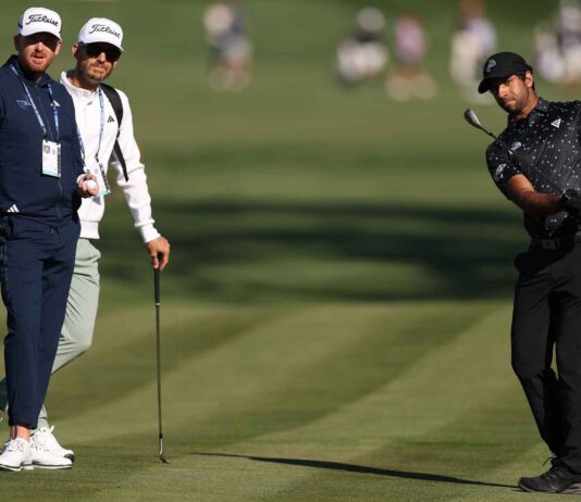 That logo on Aaron Rai’s apparel? Here’s the story (and coaches) behind it