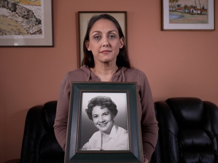 NO-LOGO-Jennifer-Gomez-seen-holding-a-portrait-of-her-grandmother-Jean-McNeil-Sargent-in-her-San-Diego-home.-Courtesy-AJ-Documentary-filmed-on-April-3-2026-NO-LOGO-1780365438.jpg