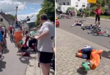 Elderly woman on mobility scooter drives into bike race, causing mass collision as cyclists somersault over handlebars: video