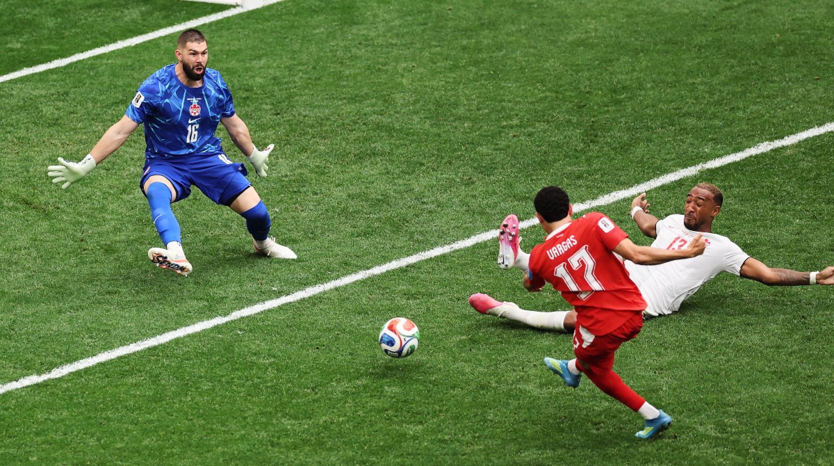 Switzerland 2-1 Canada: Swiss hold off fightback from co-hosts seal top spot in World Cup Group B