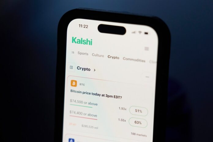 phone-displays-crypto-prices-kalshi-128939203.jpg