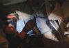 Rescuers in Venezuela race to save security guard trapped under building