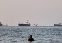 Tanker on fire off coast of Oman after being hit by projectile