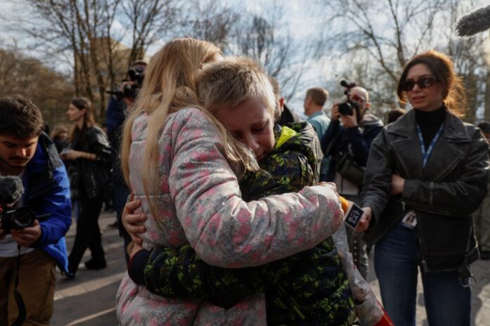 iryna-embraces-13-year-old-135973835.jpg