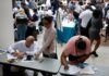 US employers add 57K jobs in June as hiring continues at a healthy clip