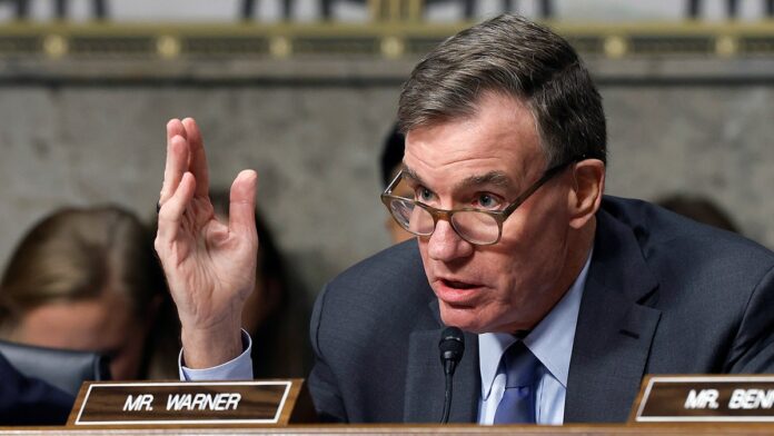 mark-warner-sits-at-hearing.jpg