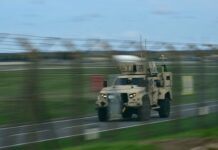 Five men arrested at RAF Fairford are all UK nationals from London, say police