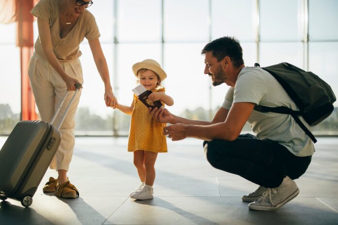Family-traveling-together-at-airport_toddler-holding-passport_-miniseries.jpg