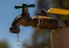Homes without water and roads closed after burst pipe