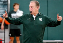 Tom Izzo speaks to the media following the first day of practice