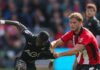 Swansea go top after victory at Lincoln