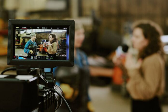 0_Caucasian-Middle-Aged-Woman-Interviewing-Young-Adult-Woman-on-Camera-Set.jpg