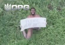 Naked Russian mercenary holds up sign pleading for help to Ukrainian drone in wild battlefield footage