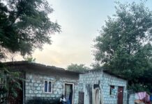 YSR Nagar Land Dispute In Kazipet Raises Questions Over Huts, Nearby Complex