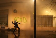 Hundreds of thousands march across France in protests over schools and policing