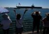 Thousands turn out to welcome weary USS Lincoln sailors after fraught stretch at sea