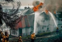 Evacuation orders as fast-moving California wildfire burns homes