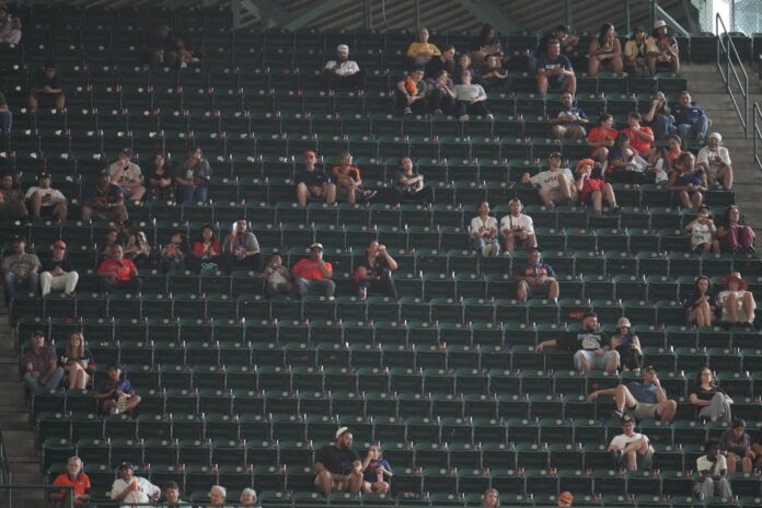 fans-sit-among-empty-seats-143065447.jpg