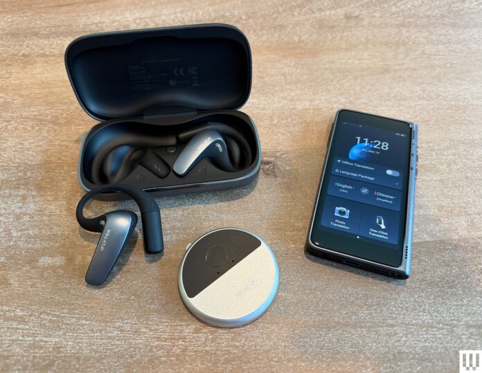 iFLYTEK%2520AI%2520Translation%2520Earbuds%2520with%2520case%2520and%2520phone%2520SOURCE%2520Christopher%2520Null.jpg