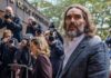 Russell Brand arrives at a London court for his trial on rape and sexual assault charges