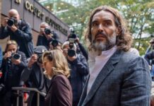 Russell Brand arrives at a London court for his trial on rape and sexual assault charges