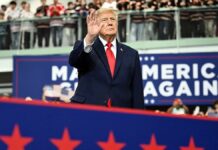 Trump signs pardons for Alaska diesel mechanics onstage during rally touting major energy deals